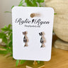MAMA Dangle Earrings In Silver - ShopSpoiled